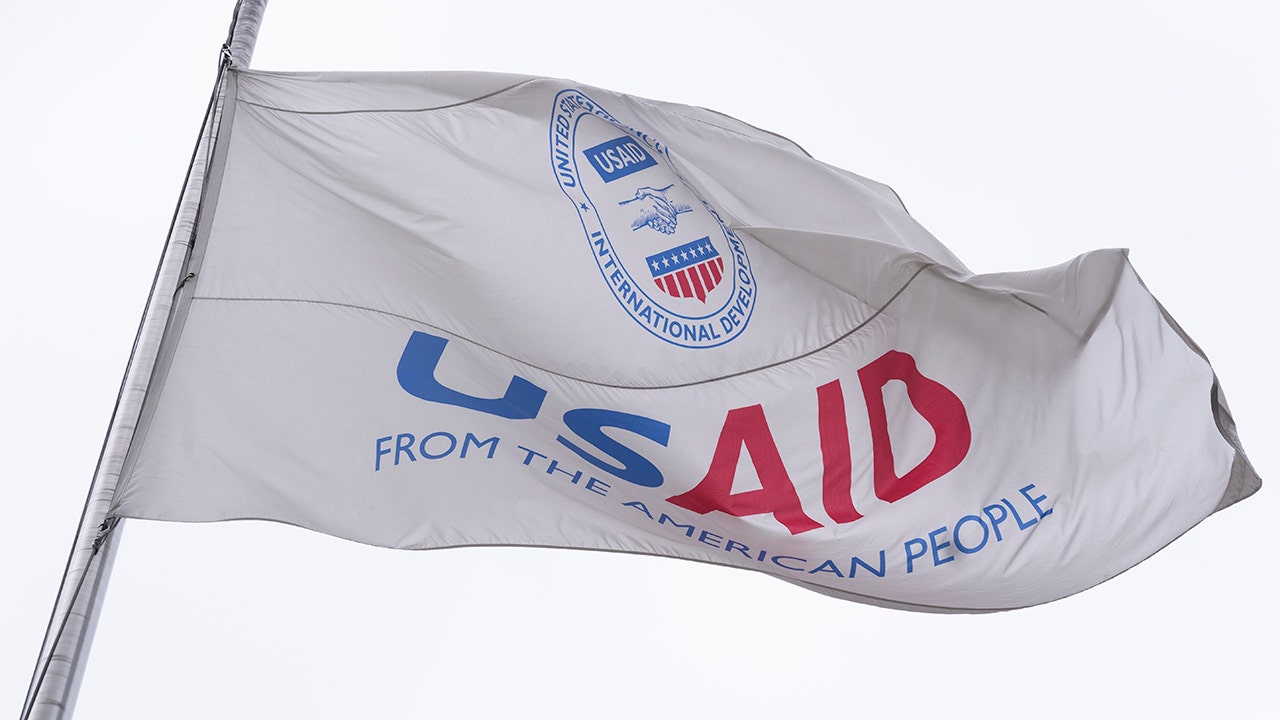 A flag with a logo on it

AI-generated content may be incorrect.