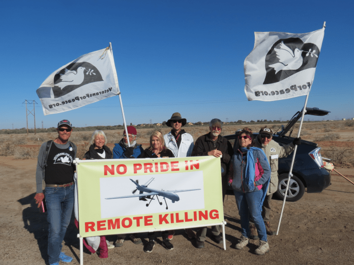 A group of people holding signs AI-generated content may be incorrect.