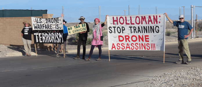 A group of people holding signs

AI-generated content may be incorrect.