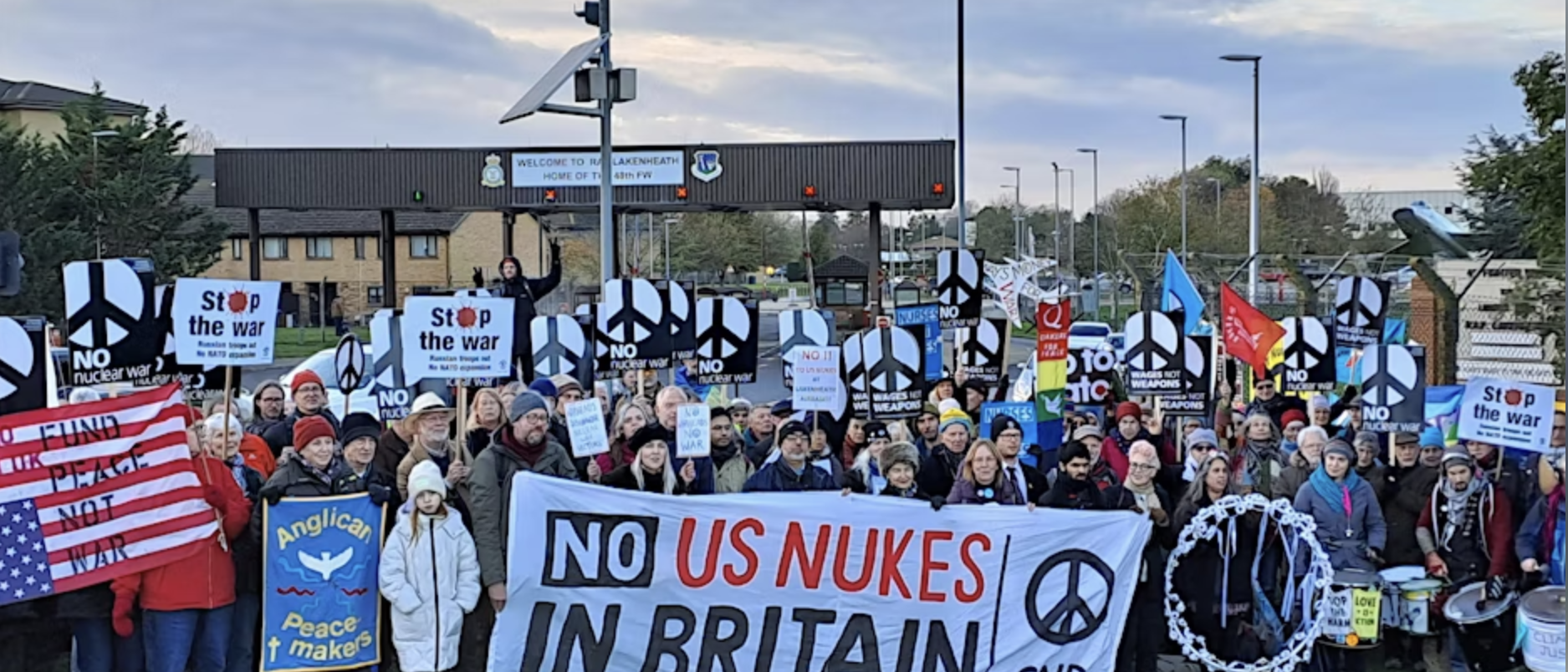 A group of people holding signs

AI-generated content may be incorrect.