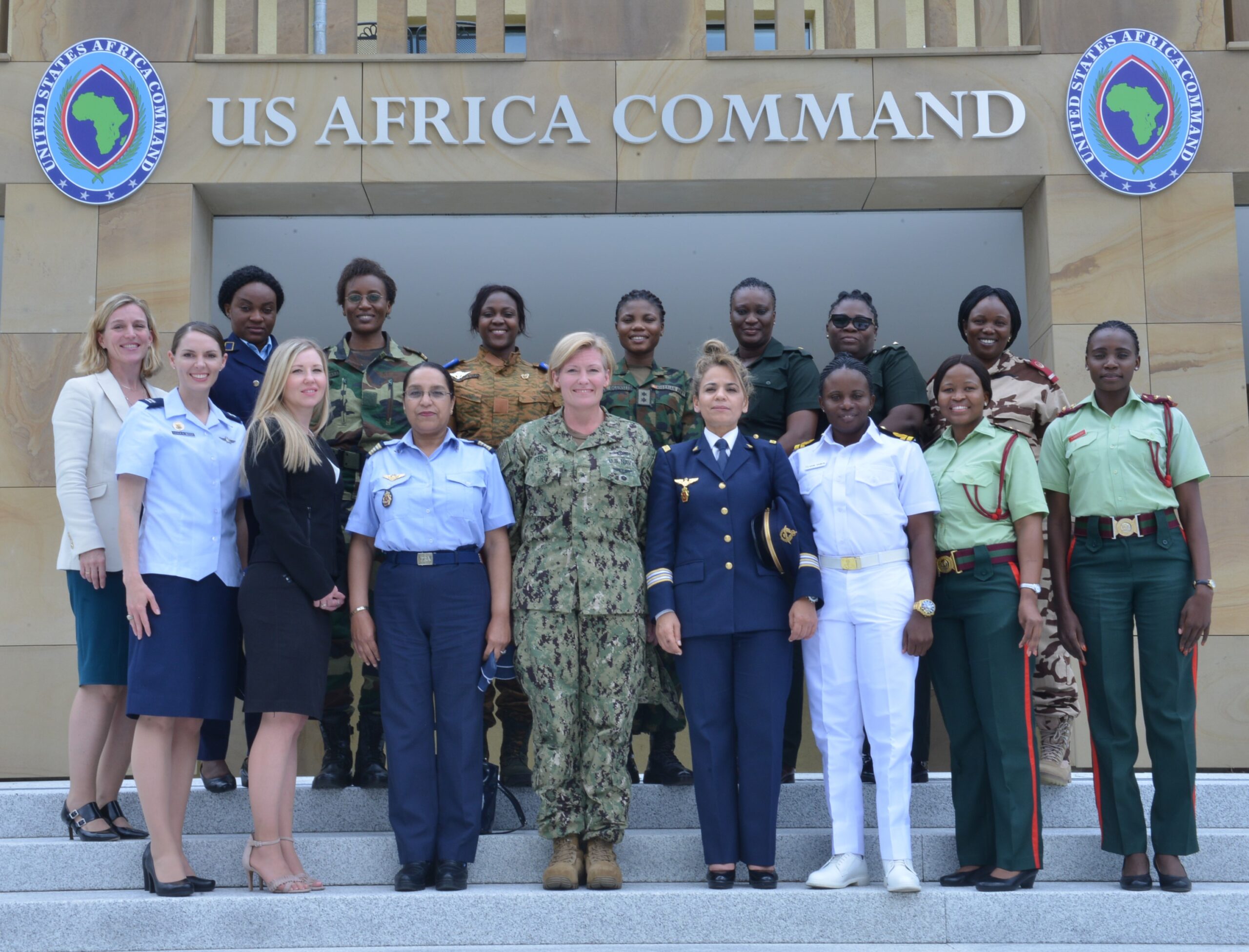 A group of women in uniform standing in front of a building
AI-generated content may be incorrect.