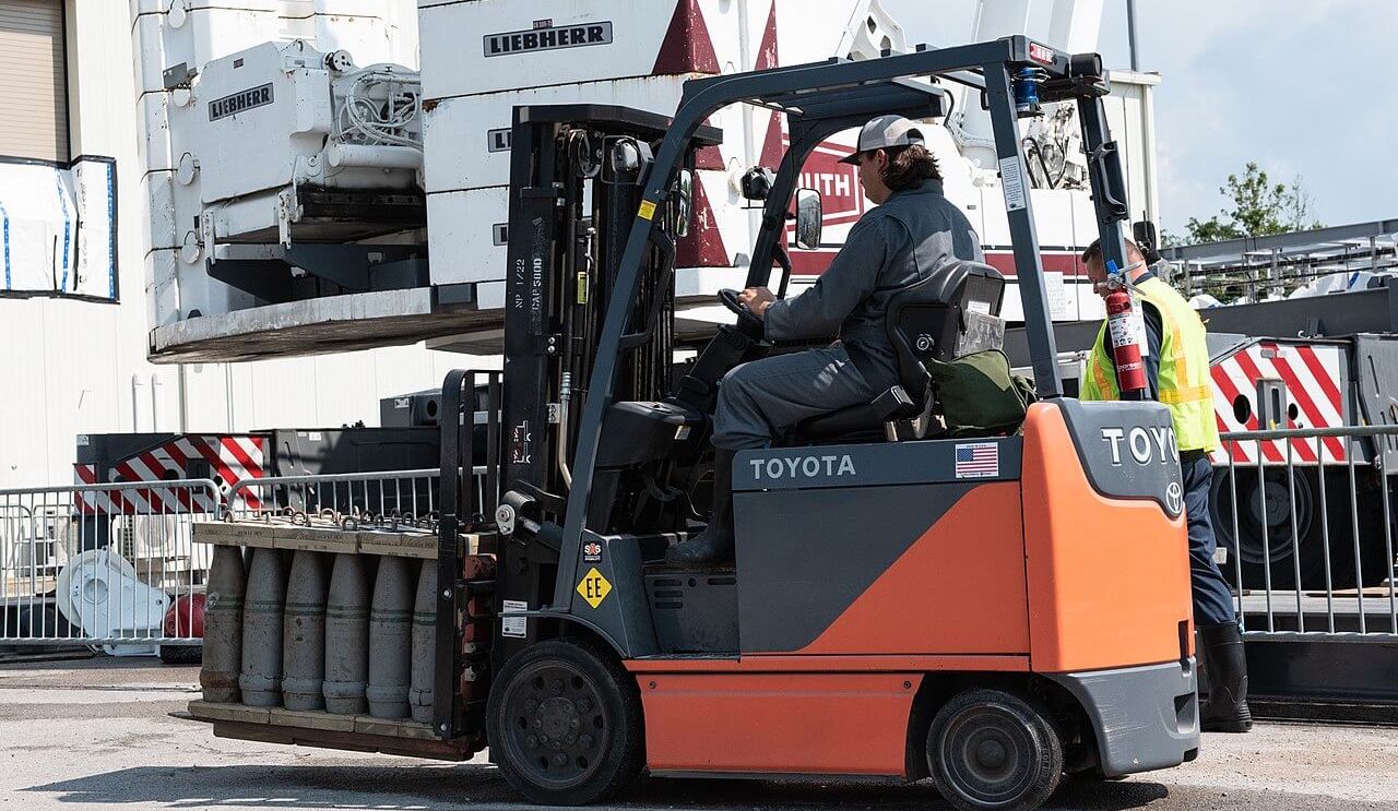 A person driving a forklift
AI-generated content may be incorrect.