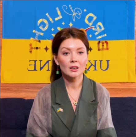 A person sitting in front of a flag
AI-generated content may be incorrect.
