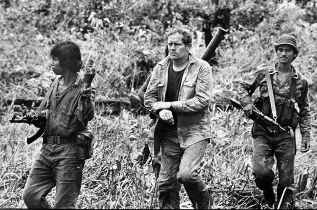A group of men walking in the jungle

AI-generated content may be incorrect.