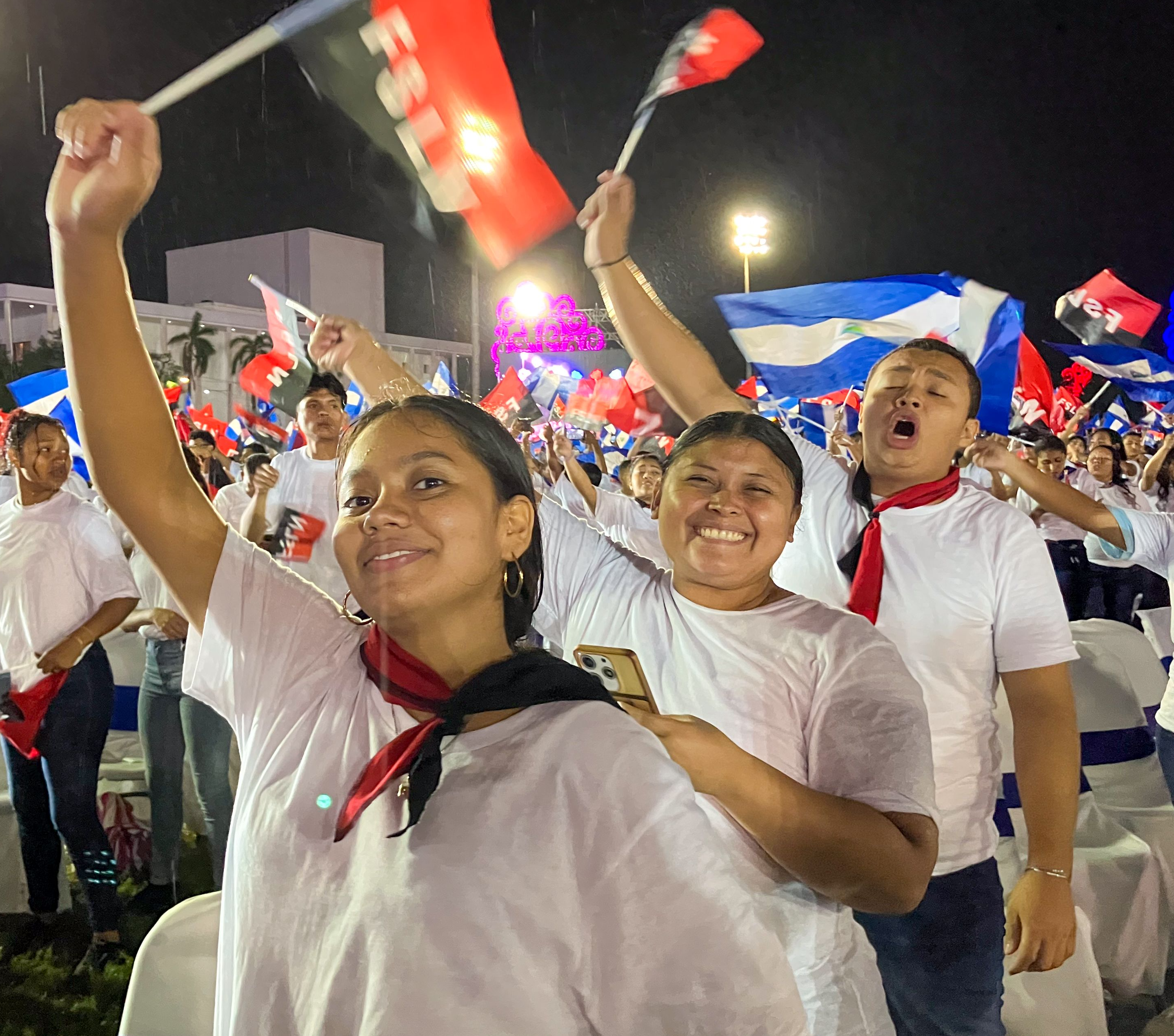 A group of people holding flags

AI-generated content may be incorrect.