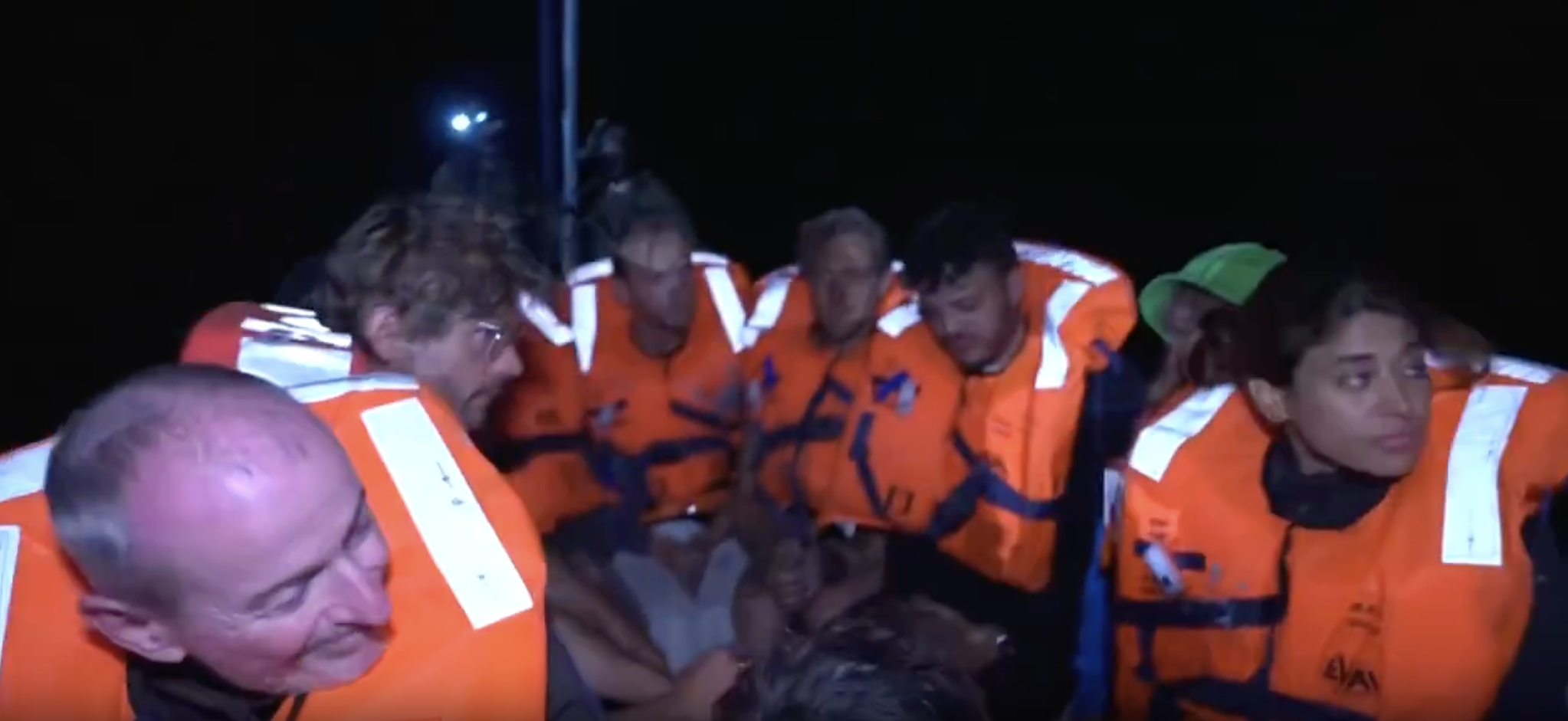 A group of people wearing orange vests

AI-generated content may be incorrect.