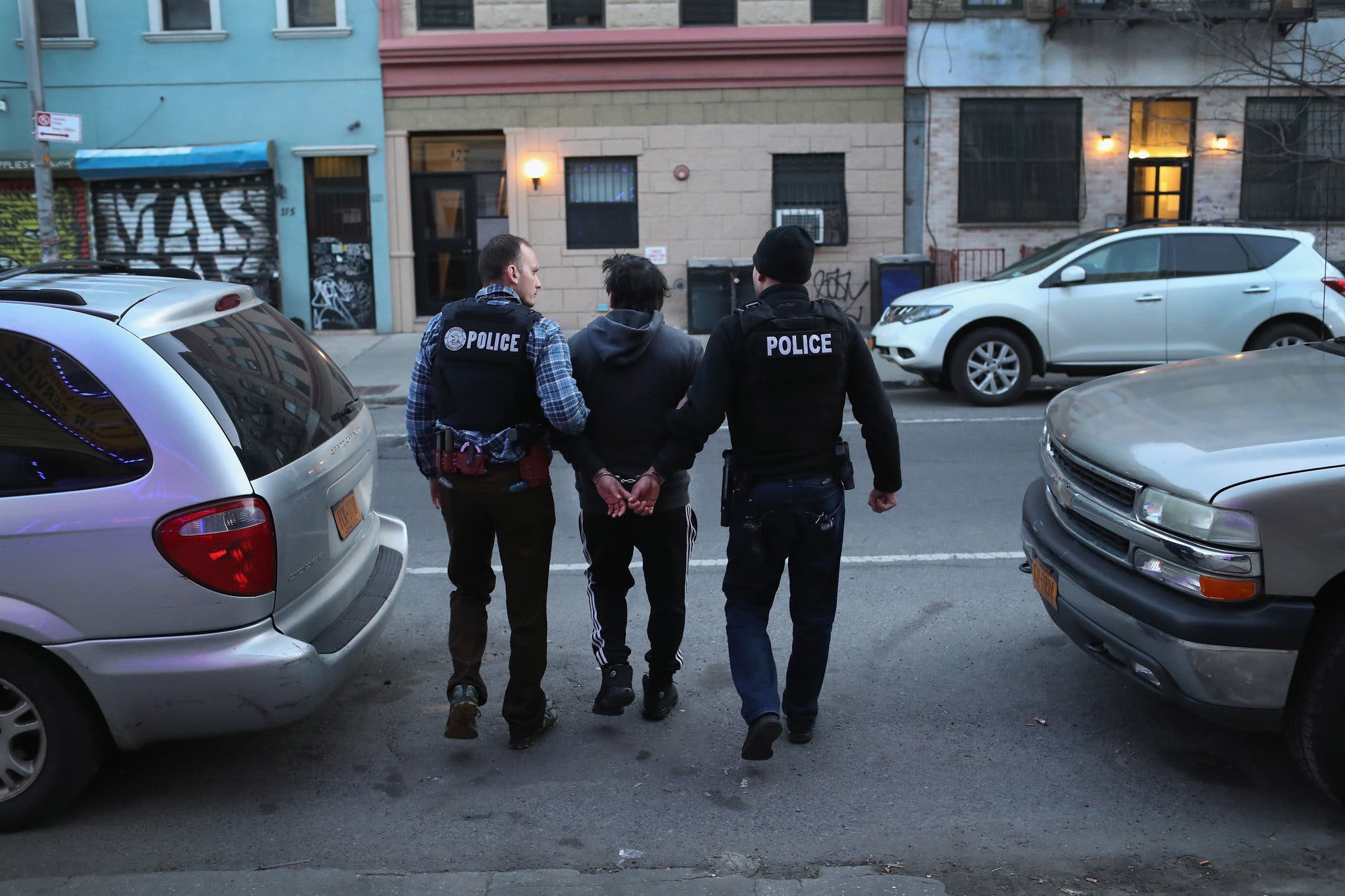 A group of police officers walking on the street
AI-generated content may be incorrect.