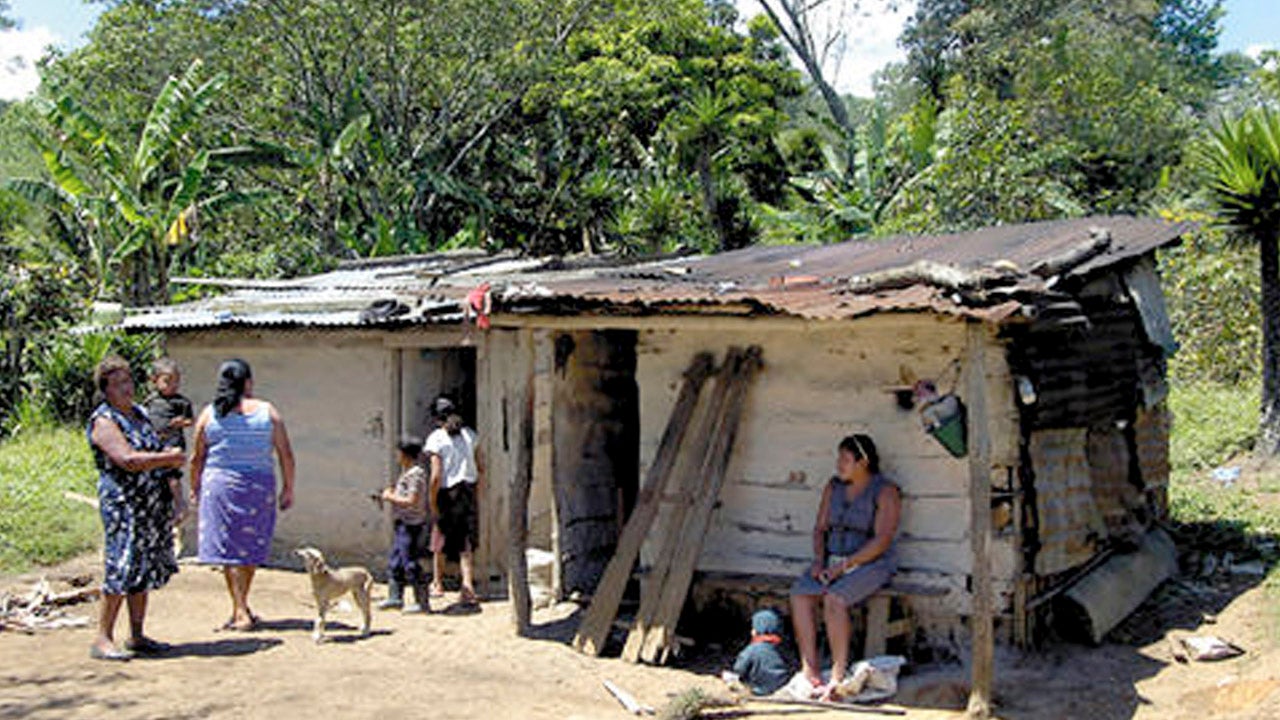 A person and person sitting on a bench outside a house
AI-generated content may be incorrect.