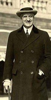A person in a suit

AI-generated content may be incorrect.