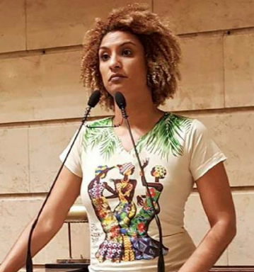 A person standing in front of a microphone
AI-generated content may be incorrect.