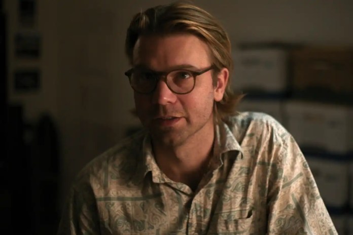 A person wearing glasses and a floral shirt
AI-generated content may be incorrect.