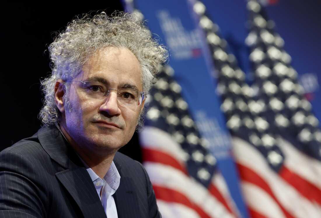 This photo shows Alex Karp, CEO of Palantir, photographed from about the shoulders up.