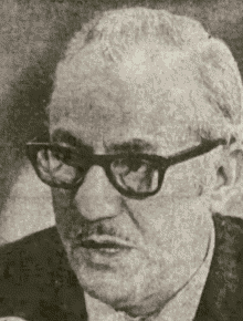 A close-up of a person wearing glasses

AI-generated content may be incorrect.