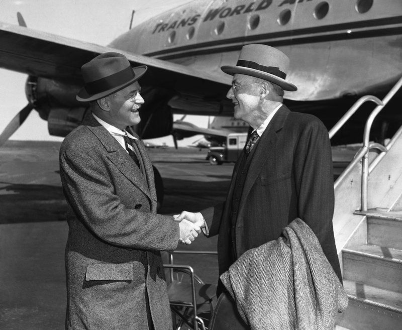 A couple of men shaking hands
AI-generated content may be incorrect.