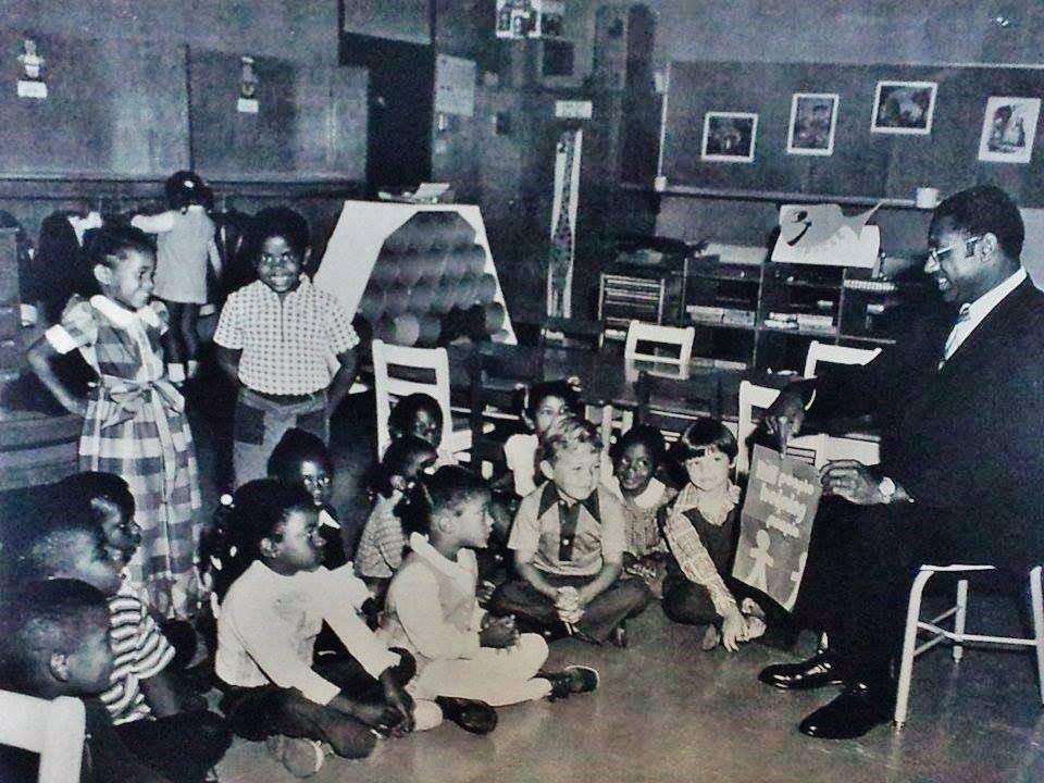 A group of children in a classroom
Description automatically generated