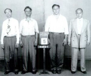 A group of men standing in a row

AI-generated content may be incorrect.
