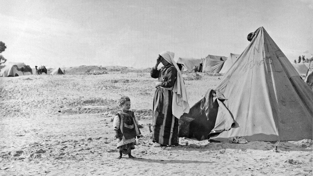 A person and child standing in the desert

AI-generated content may be incorrect.