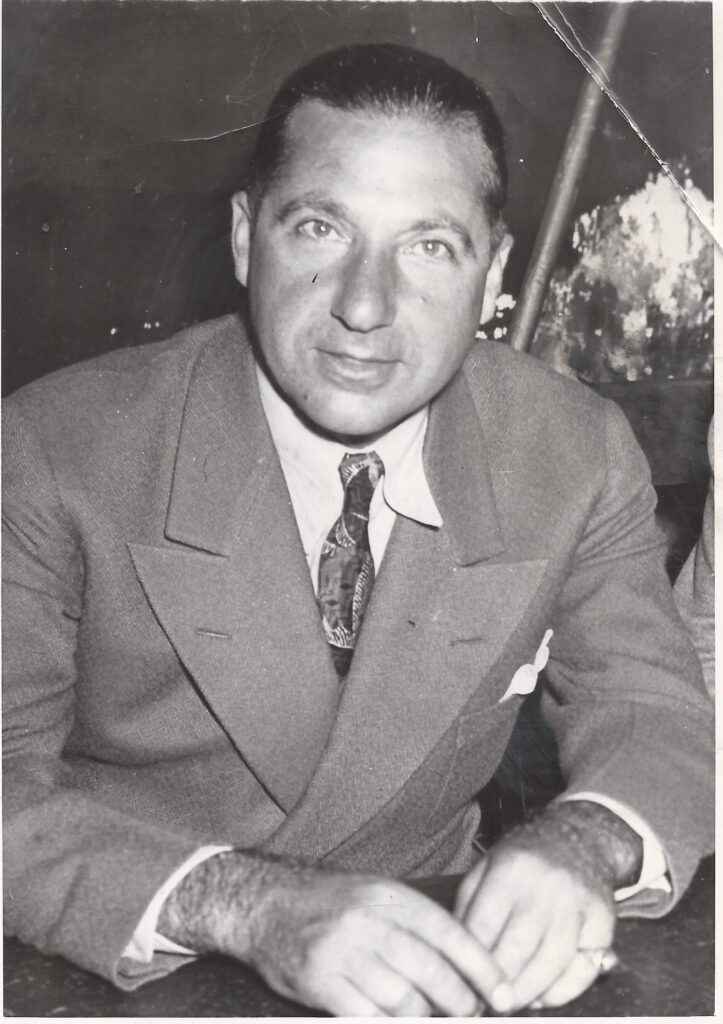 A person in a suit and tie

AI-generated content may be incorrect.