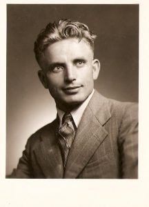 A person in a suit and tie
AI-generated content may be incorrect.