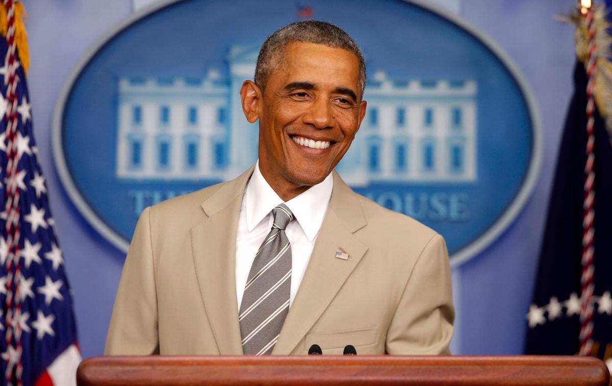 A person in a suit and tie smiling
AI-generated content may be incorrect.