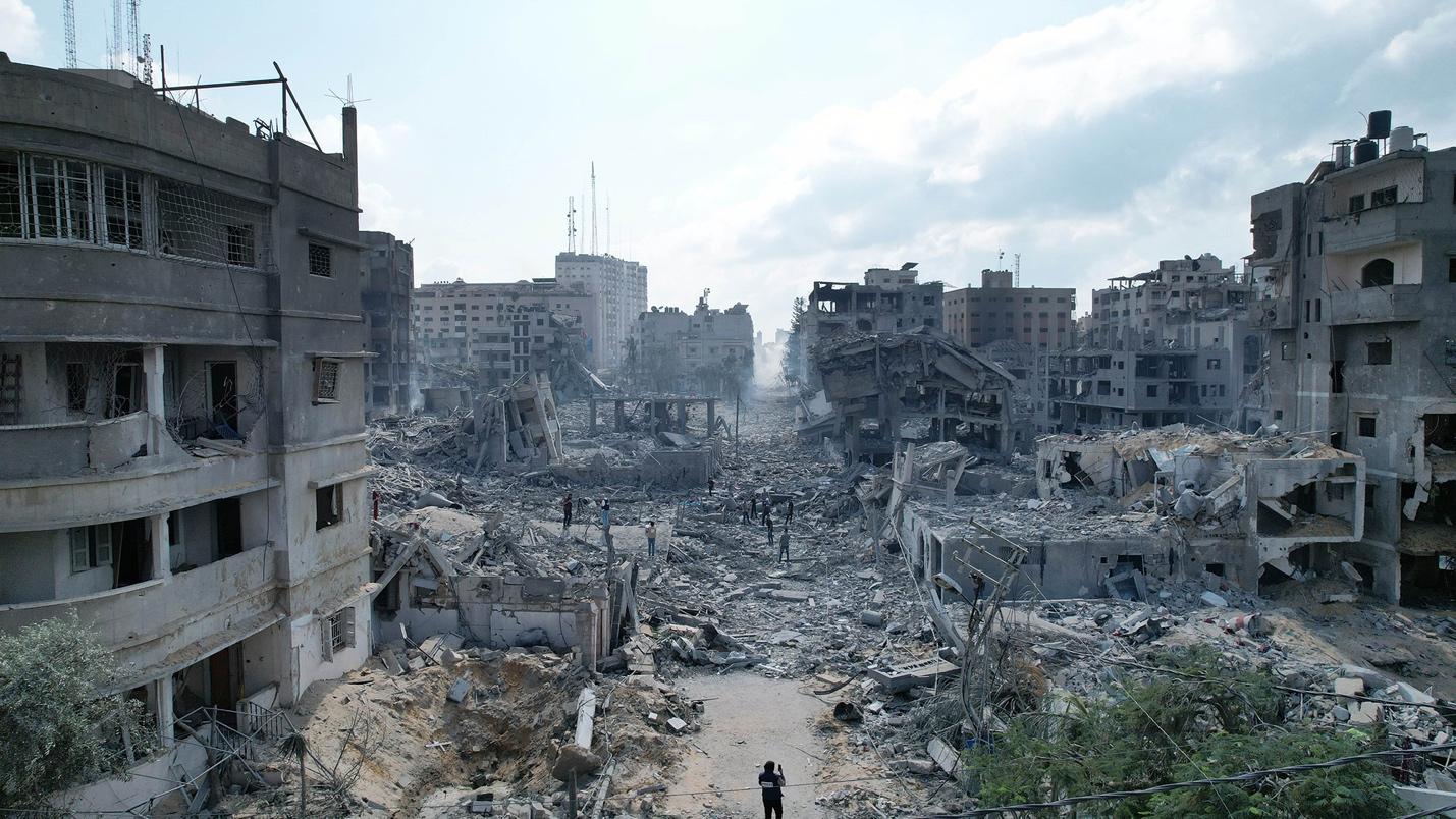 A person standing in front of a destroyed city
AI-generated content may be incorrect.