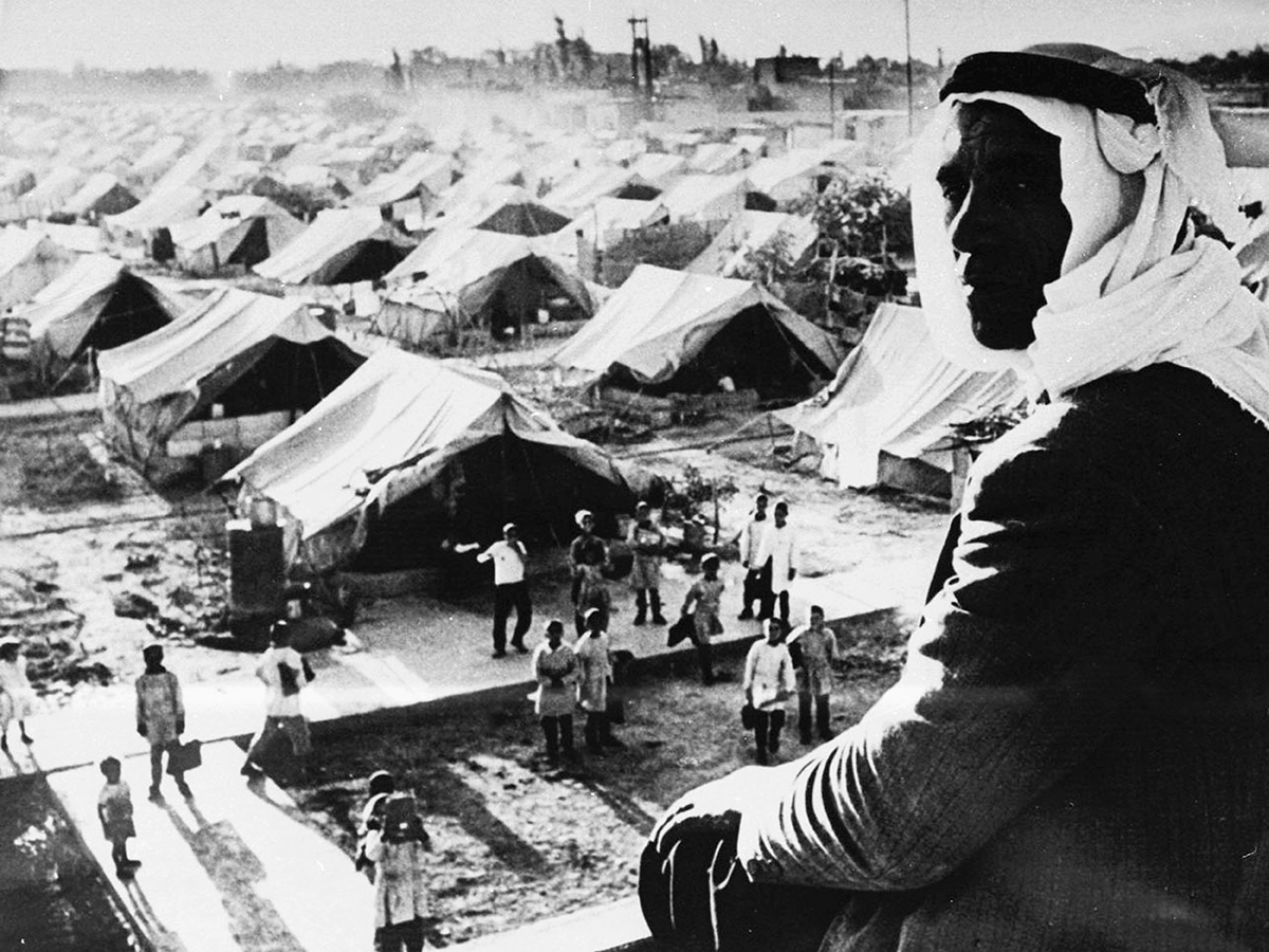 A person standing in front of a group of tents

AI-generated content may be incorrect.