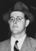 A person wearing a hat and suit
AI-generated content may be incorrect.