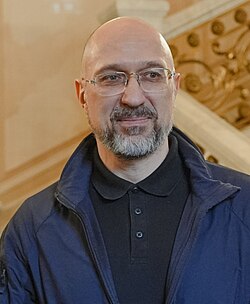 A person wearing glasses and a blue jacket

AI-generated content may be incorrect.