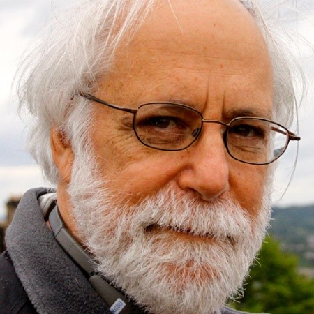 A person with a beard and glasses
AI-generated content may be incorrect.