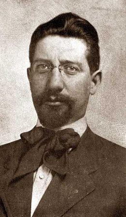 A person with a beard and mustache wearing glasses

AI-generated content may be incorrect.