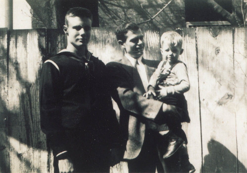 Hiss's stepson Timothy Hobson (age 17), Alger Hiss and his son Tony (age 2) in wartime Washington D.C., winter 1944. Hobson is wearing his Navy V-12 cadet uniform.