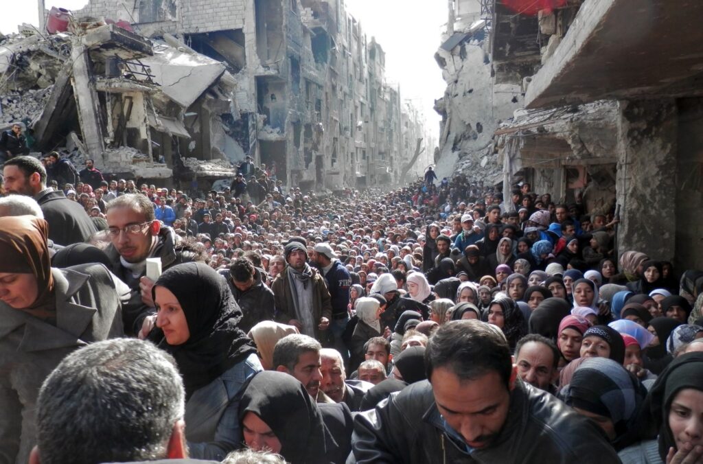 The Yarmouk refugee camp in Damascus, pictured above in a 2014 photo, has been described as a “living hell” and “the “worst place on Earth.”