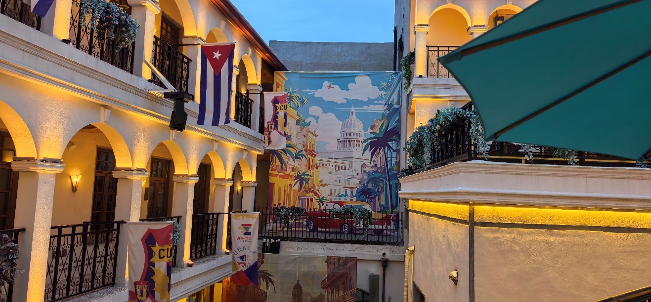 A courtyard with a mural on the wall

AI-generated content may be incorrect.