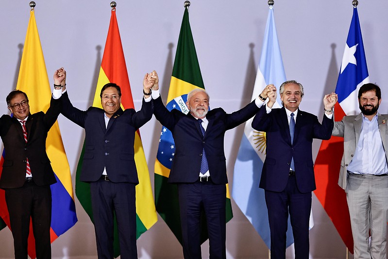 A group of men holding their hands up
AI-generated content may be incorrect.