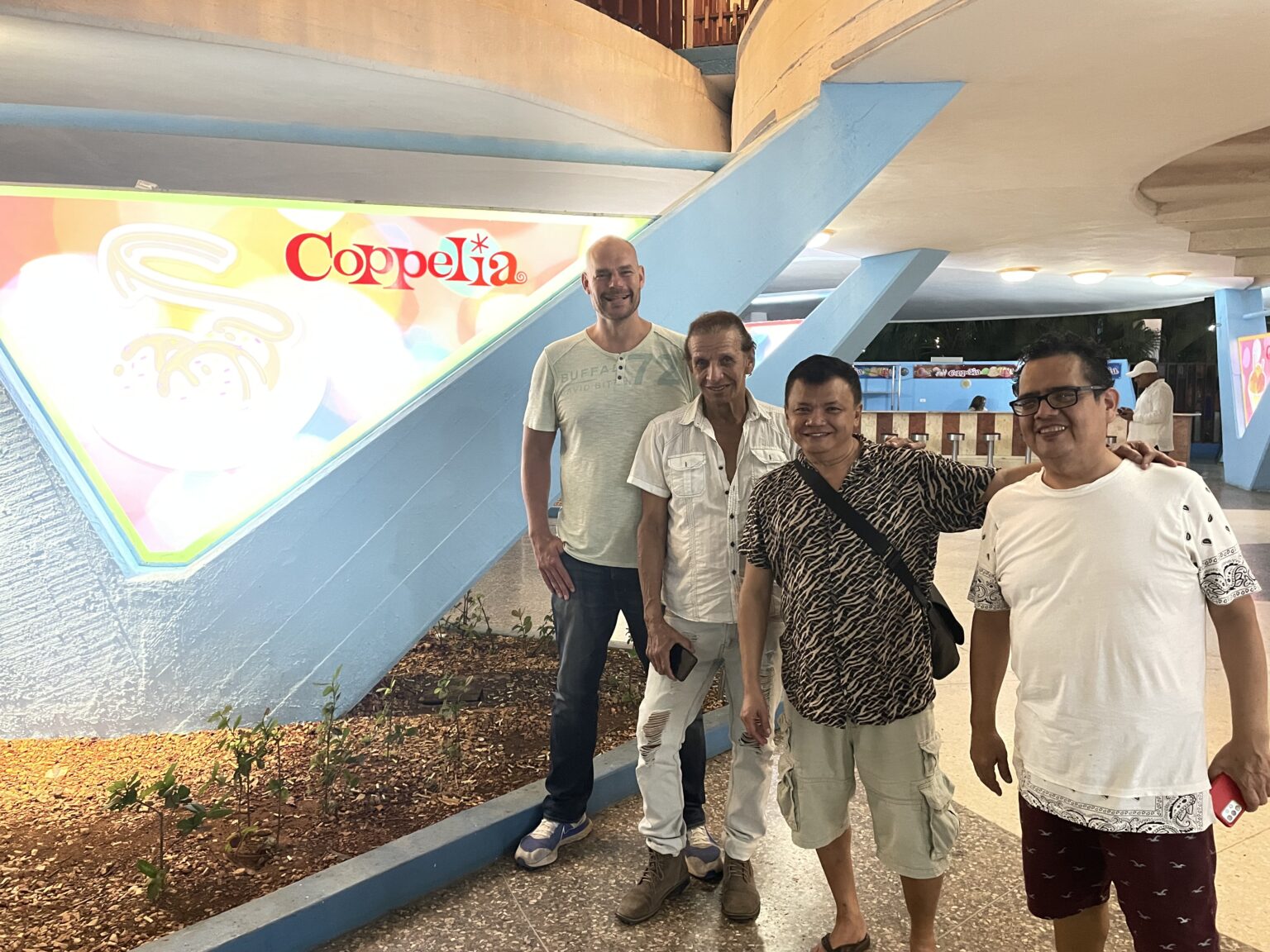 A group of men standing in front of a sign
AI-generated content may be incorrect.