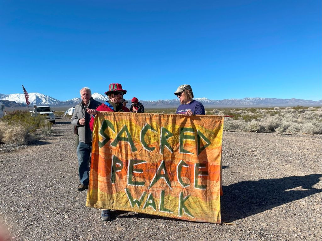 A group of people holding a banner

AI-generated content may be incorrect.