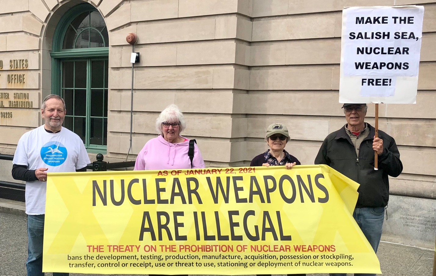 A group of people holding a sign

AI-generated content may be incorrect.