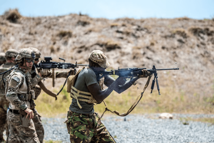 A group of soldiers holding guns AI-generated content may be incorrect.
