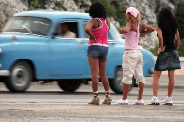 A group of women standing in the street
AI-generated content may be incorrect.