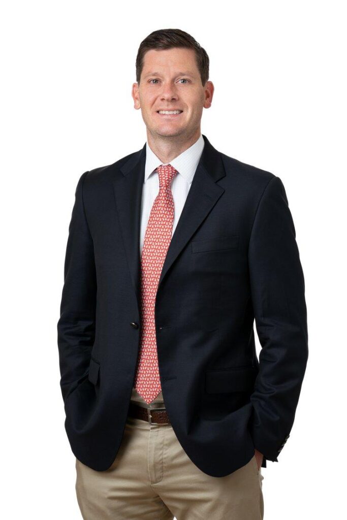 A person in a suit and tie
AI-generated content may be incorrect.