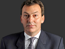 A person in a suit and tie
Description automatically generated