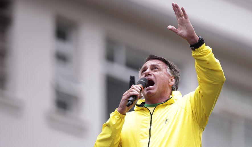 A person in a yellow jacket holding a microphone
AI-generated content may be incorrect.