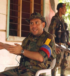 A person in military uniform sitting in a chair

AI-generated content may be incorrect.