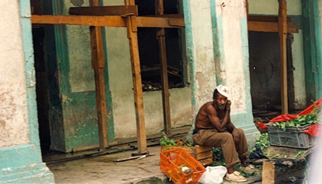 A person sitting on a bench outside a building
AI-generated content may be incorrect.