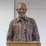 A person standing at a podium

AI-generated content may be incorrect.