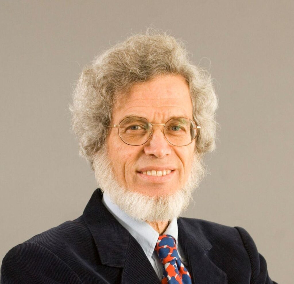 A person with a white beard and glasses
AI-generated content may be incorrect.