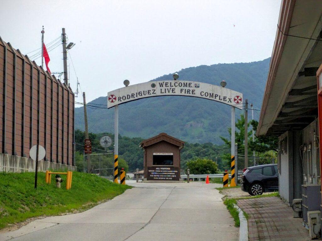 A sign over a road
Description automatically generated