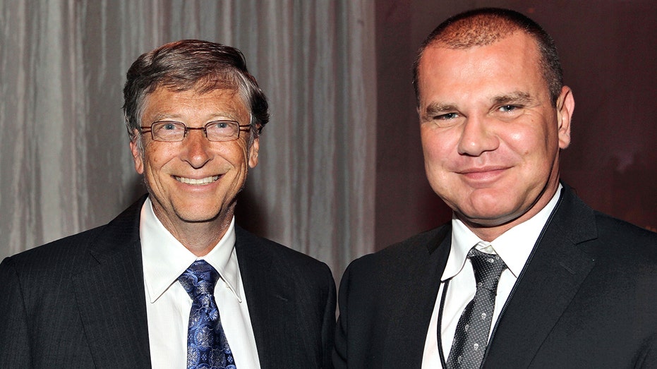 A couple of men in suits

AI-generated content may be incorrect.