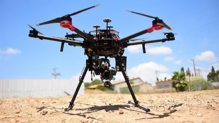 A drone with a camera on the ground

AI-generated content may be incorrect.