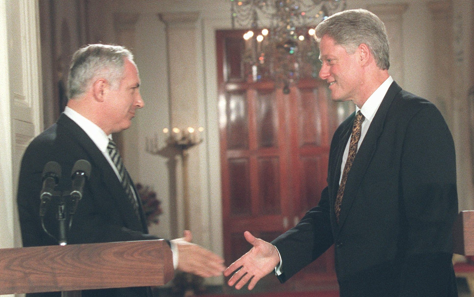 A few men shaking hands

AI-generated content may be incorrect.